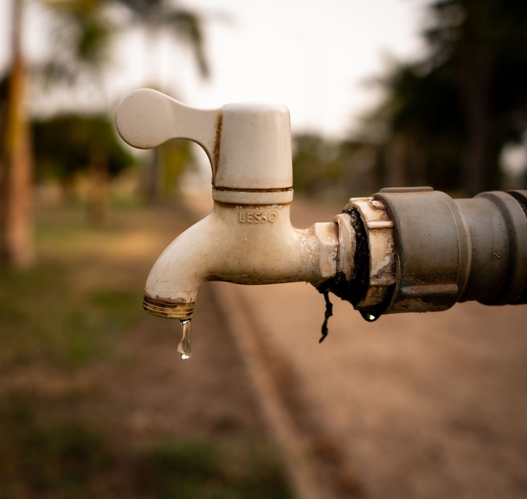 Close-up of a dripping outdoor tap